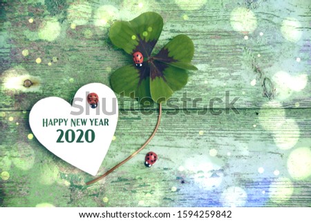 Happy New Year 2020 -Greeting card - four-leaf clover with ladybird - symbols of luck