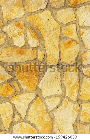 Background of a large stone wall texture (yellow)
