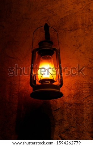 ranthal lamp hanging in the night on a wall