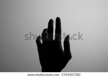 Silhouette hand black and white finger body part help alone