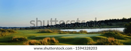 Golf course by water dam