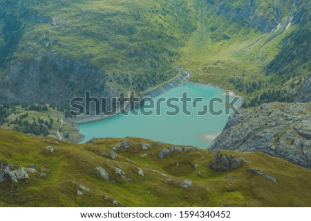 Beautiful view of the spring landscape on the reservoir and the river in the Alps. Austria