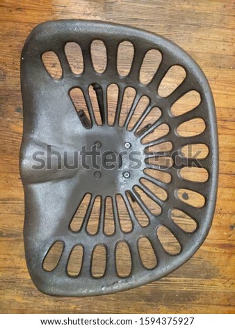 A cast iron Tractor seat 