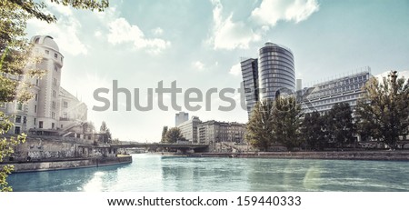 The Donaukanal (Danube Canal) of Vienna, Austria. Picture Style achieved with digital cross processing technique.
Left, the historic building Urania opposite the new contemporary building Uniqa Tower