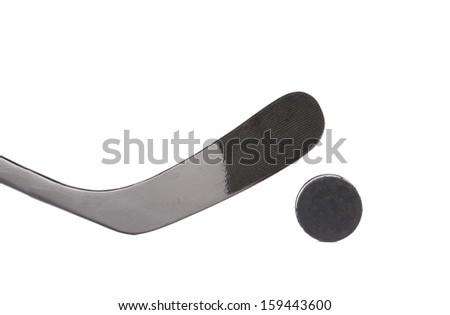 Black ice hockey stick and puck. Isolated on a white backgropund.