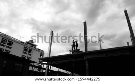 Black and white picture People building blocks Building evening time