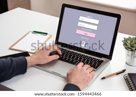 Password login on computer screen, Unlock laptop, cyber lock internet security concept. Man working on an office desk