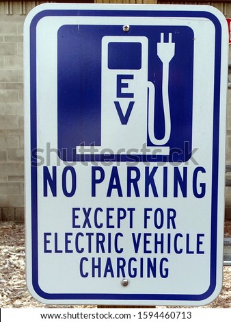 A no parking sign except for Electric Vehicles 