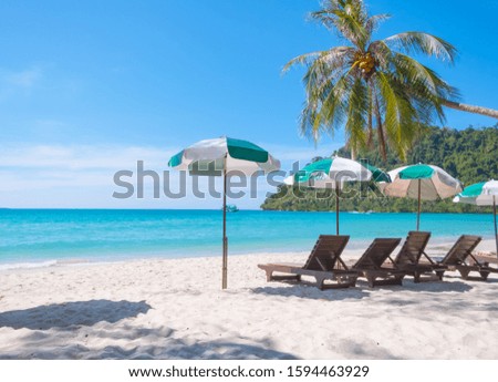 Seascape with chaise longues,Tropical beach background as summer landscape white sandy and calm sea for beach banner