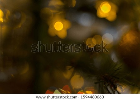 fantasy christmas blurred background with luminous fire and christmas tree