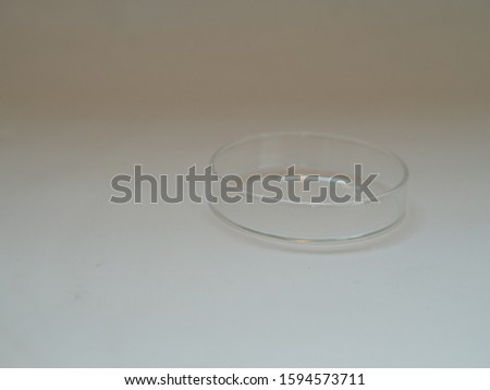 A Petri dish (alternatively known as a Petri plate or cell-culture dish) is a shallow transparent lidded dish that biologists use to culture cells such as bacteria, or small mosses.