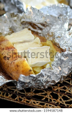 jacket potatoes in foil with herbs and oil cooking process