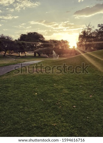 Sunset captured over a lusciously green Golf course.