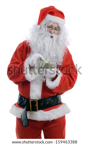 Searching for christmas he perfect gift or bargain, santa's hand holding a magnifying glass isolated on a white background