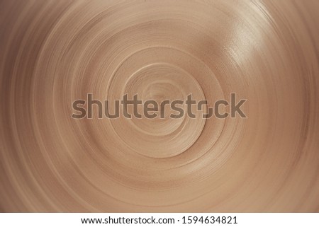 view of spiral lines of raw clay in the ceramic plate, abstract background of infinity with copy space