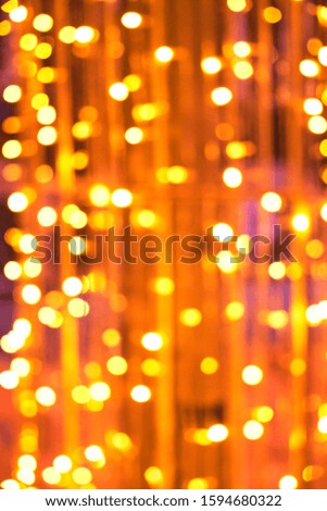 Abstract background of bright orange glowing Christmas garlands.