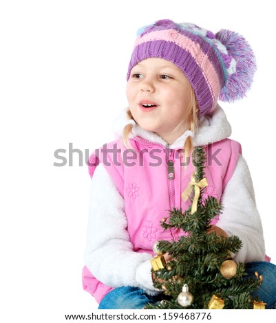 portrait of a little girl dressed in winter clothes, christmas, new year, Christmas tree 
