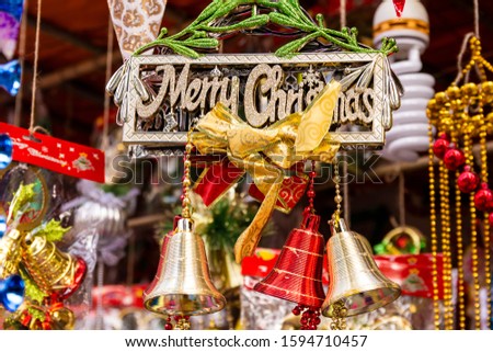 Merry Christmas written board, Christmas ball and Christmas bells for Holiday home decoration , Happy new year 2020.