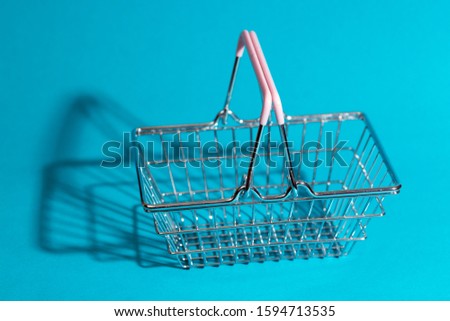 Prices for shopping consumer basket products. empty basket on a blue background

