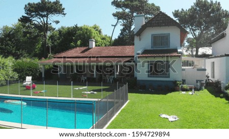Beautiful home exterior Establishing shot of house in sunny day