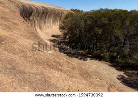 Wave Rock is a natural rock formation that is shaped like a tall breaking ocean wave.  Wave Rock Country, Western Australia, Australia.