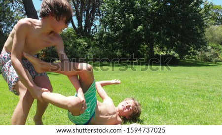Siblings wrestling and fighting each other in rivalry  Real life fight between brothers