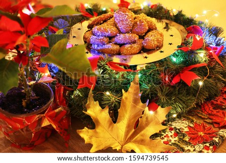 traditional greek melomakarona on the table - traditional greek cookies with honey and walnuts - night home Christmas scene