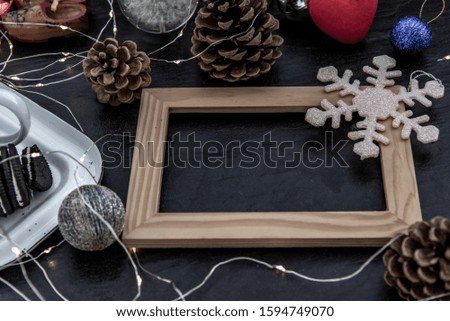 Christmas decoration with Empty wooden frame for work about design element.  Selective focus, Oblique view from the top, copy space
