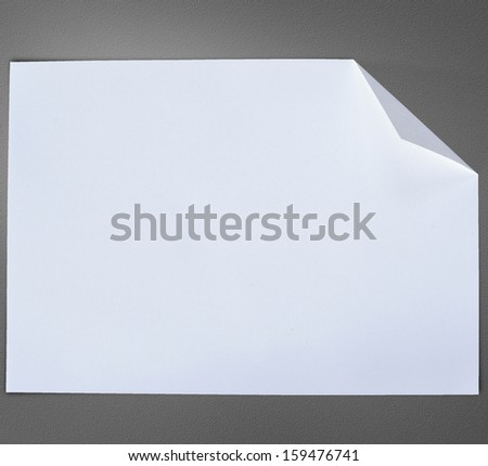Folded empty white paper on background.