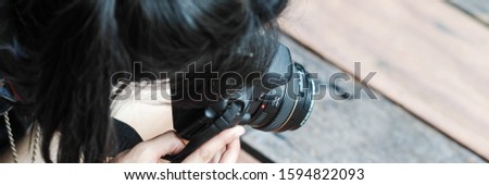 A woman with a camera