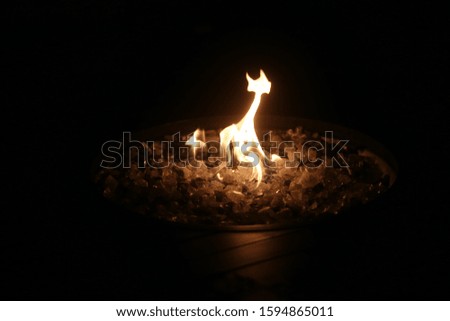 Fire in the dark inside a fire pit