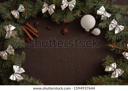 Christmas background frame with fir branches and balls.