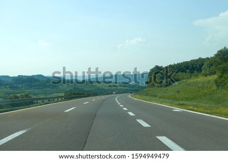 Highway going through a picturesque landscape in springtime