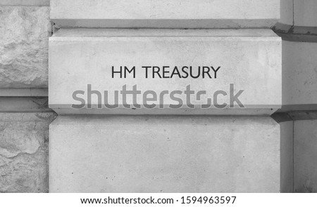 HMRC (Her Majesty Treasury) sign in London, UK in black and white Royalty-Free Stock Photo #1594963597