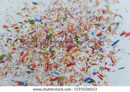 white Surface covered with colorful pencil graphite chips