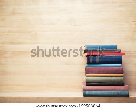 Old books on a wooden shelf.  Royalty-Free Stock Photo #159503864