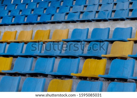 A field of empty seats in a open stadium
