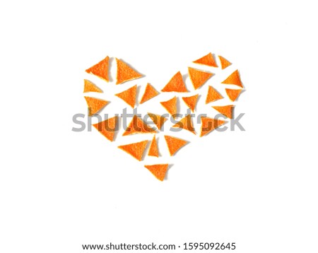 Heart of tangerine crusts on a white background. Valentine's day object