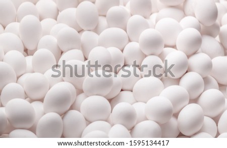 Close-up of many white eggs  background. Royalty-Free Stock Photo #1595134417