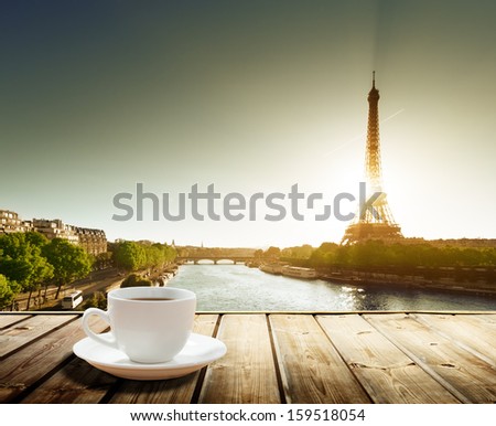 coffee on table and Eiffel tower in Paris 