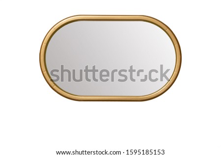 A oval mirror with a golden frame