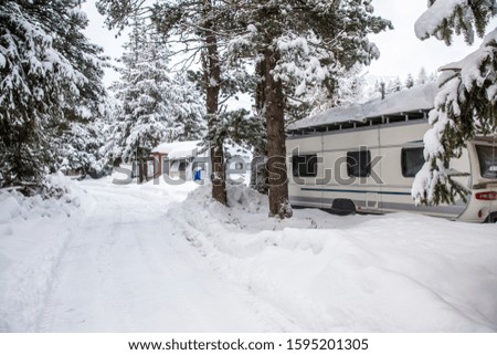 Camping in the Winter. Campsite with caravans in the snow.