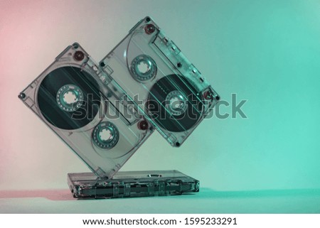 Close up Beautiful Audio cassette tape in neon  light.Minimalism retro style concept. 80s. Background pattern for design.
