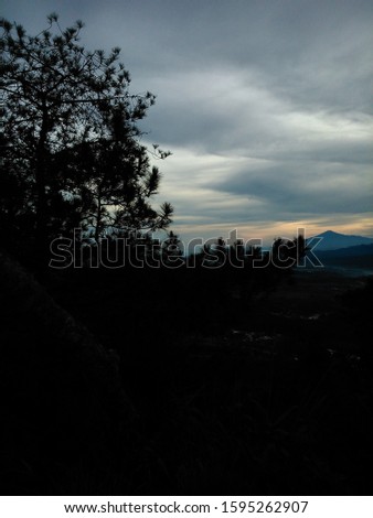 blurry shots through heavenly beautiful sunny flare and landscape in the morning. hiking lifestyle concept skyline view, Manglayang Mountain, Indonesia. 