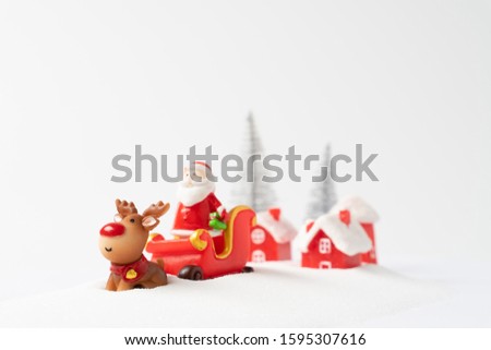 santa claus and reindeer with snow background