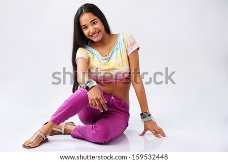 Young cute latin american girl smiling isolated on white background