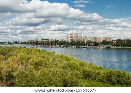 green forest, river, big sky and cityscape on the back