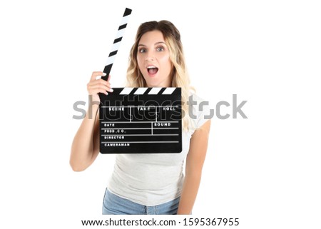 Young woman with blank clapper board on white background