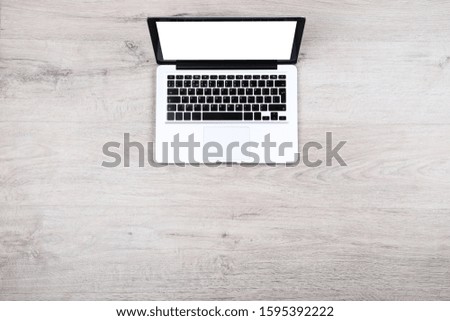 Laptop computer on wooden table