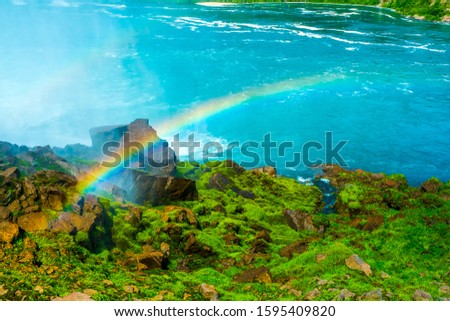 Rainbow background. Rainbow reflecting water.Rainbow near the bottom of the falls where the landmark stop for the tourist to take picture at Niagara Falls in United States side cross border of Canada.